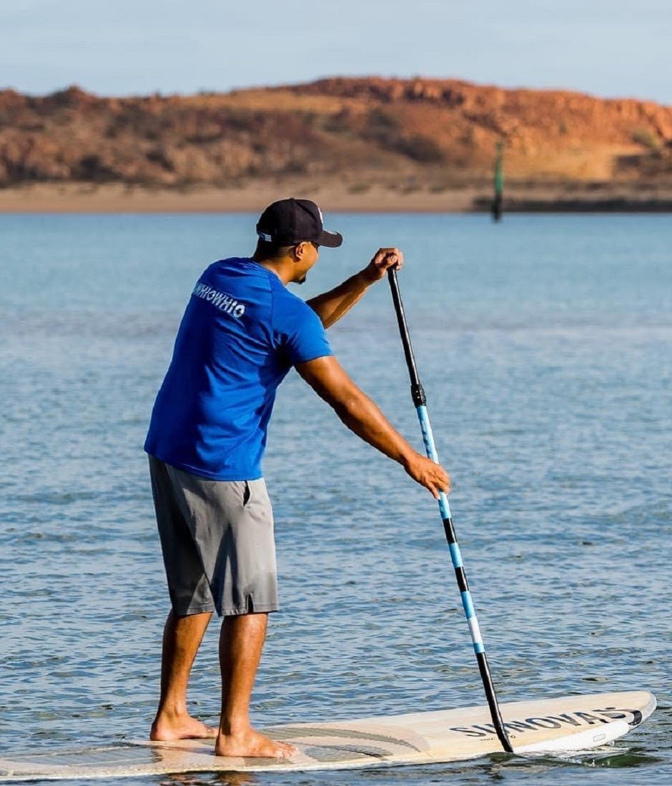 Sunova Stand Up Surf Shop SUP man paddling hire board 940x1100