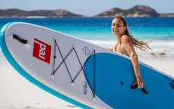 stand up surf shop red paddle inflatable sup girl carrying